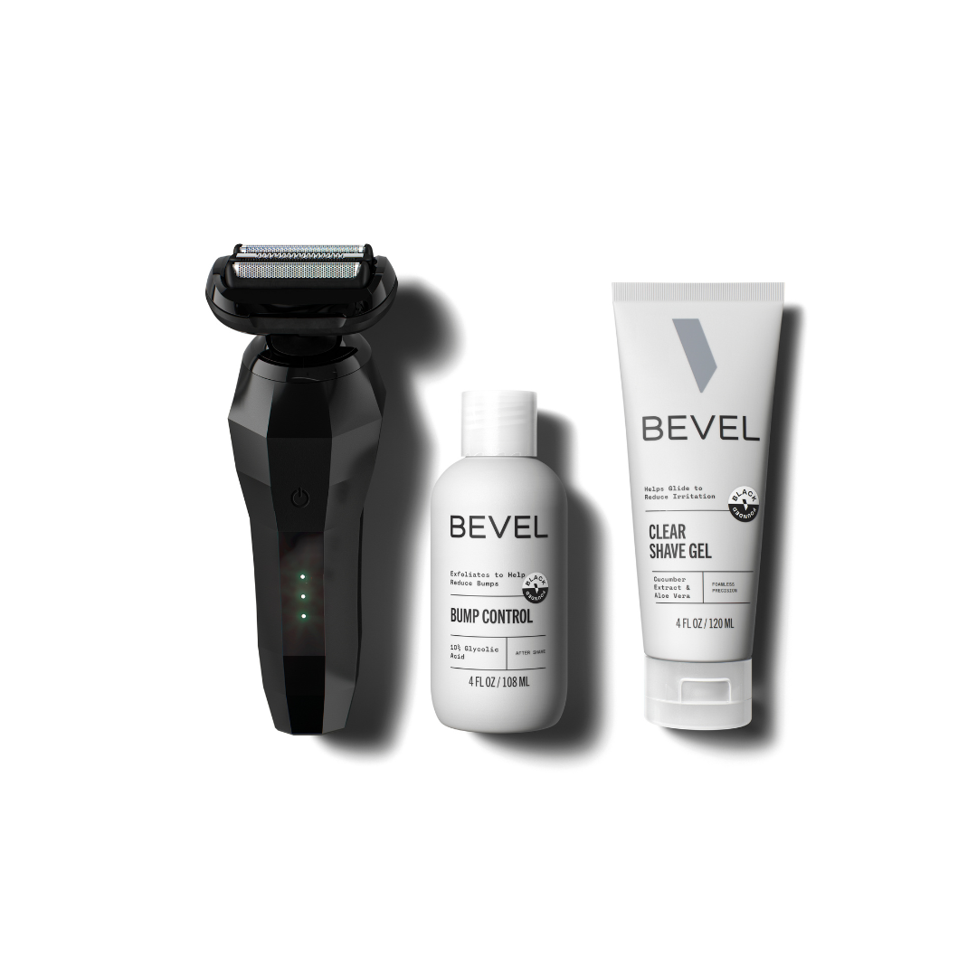 A set of grooming products including a black Bevel electric shaver, a bottle of Bevel Clear Shave Gel, and a tube of Bevel Post Shave Bump Control.