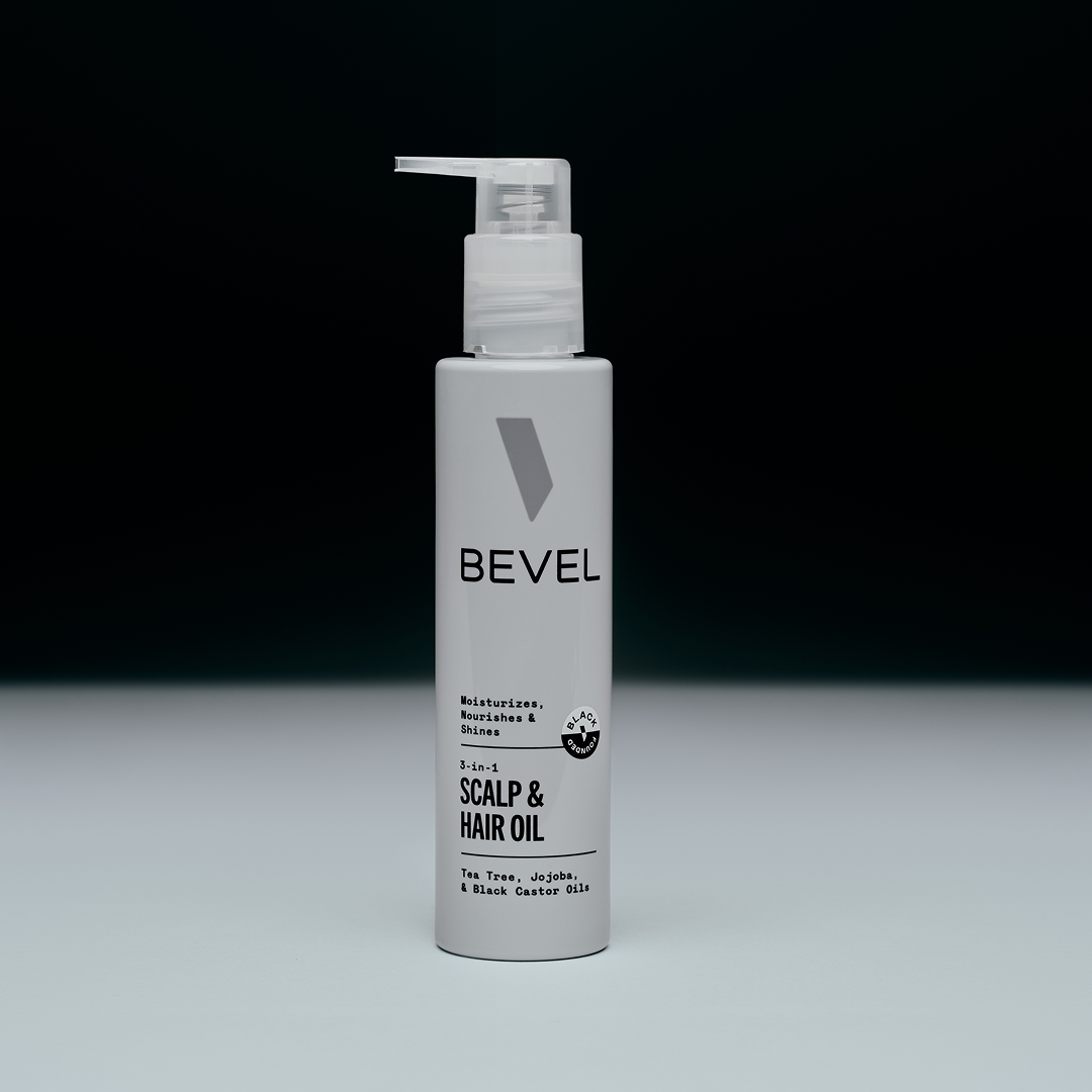 Bevel scalp and hair oil bottle on a gray background