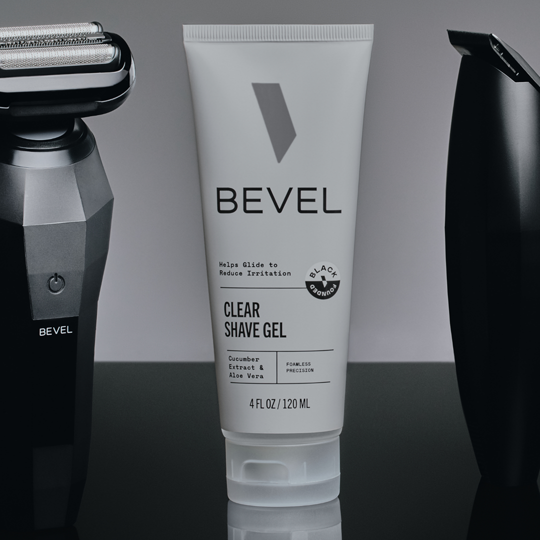 Bevel clear shave gel tube with a razor on a gray background