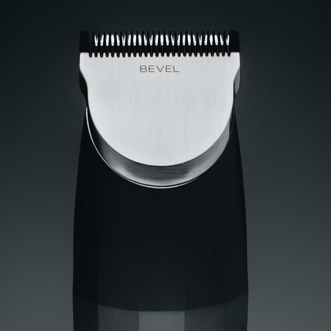 Black and silver BEVEL grooming tool on a dark background