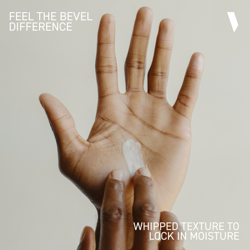 Hand with whipped texture on palm against a neutral background, promoting skincare product.