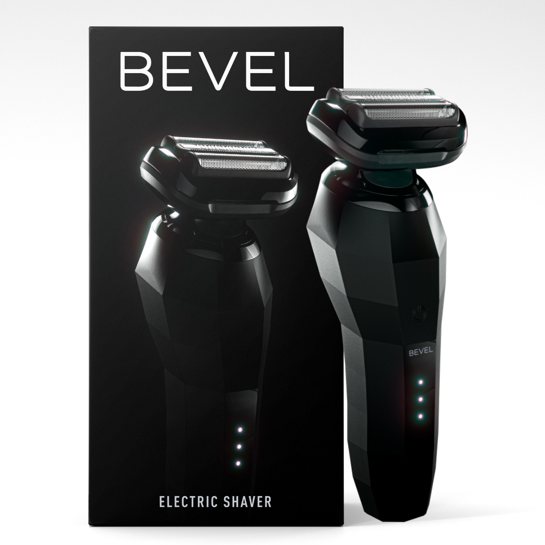 An electric foil shaver by Bevel, displayed alongside its packaging. The shaver is black with a geometric design, and the packaging has the brand name 'BEVEL' prominently displayed.