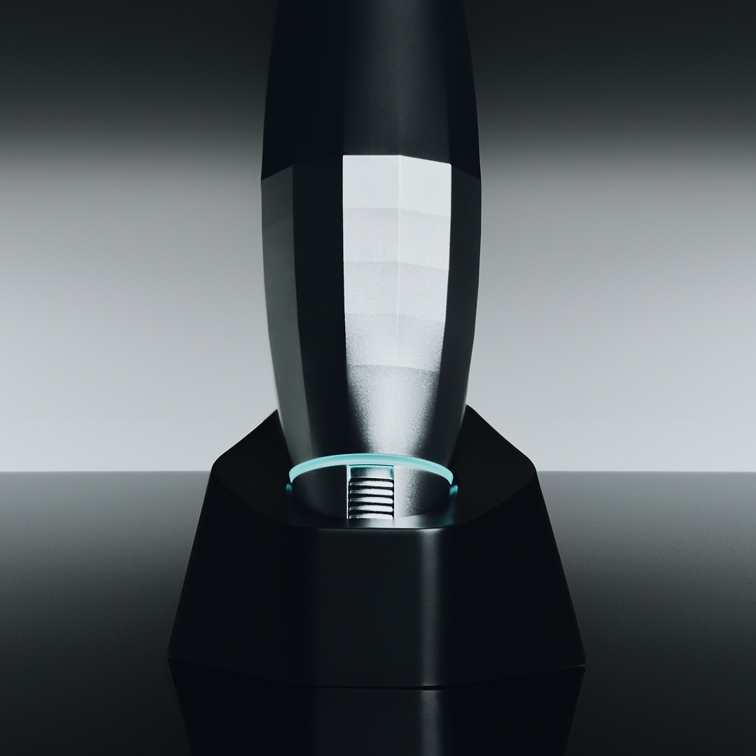 Black and silver electronic device on a dark background