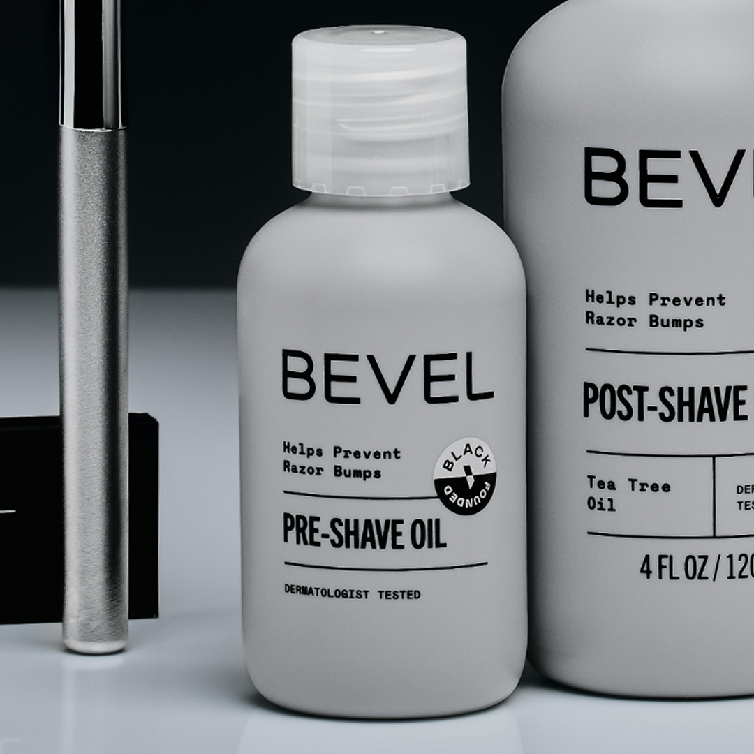 Bevel pre-shave oil bottle with a razor and post-shave product in the background.